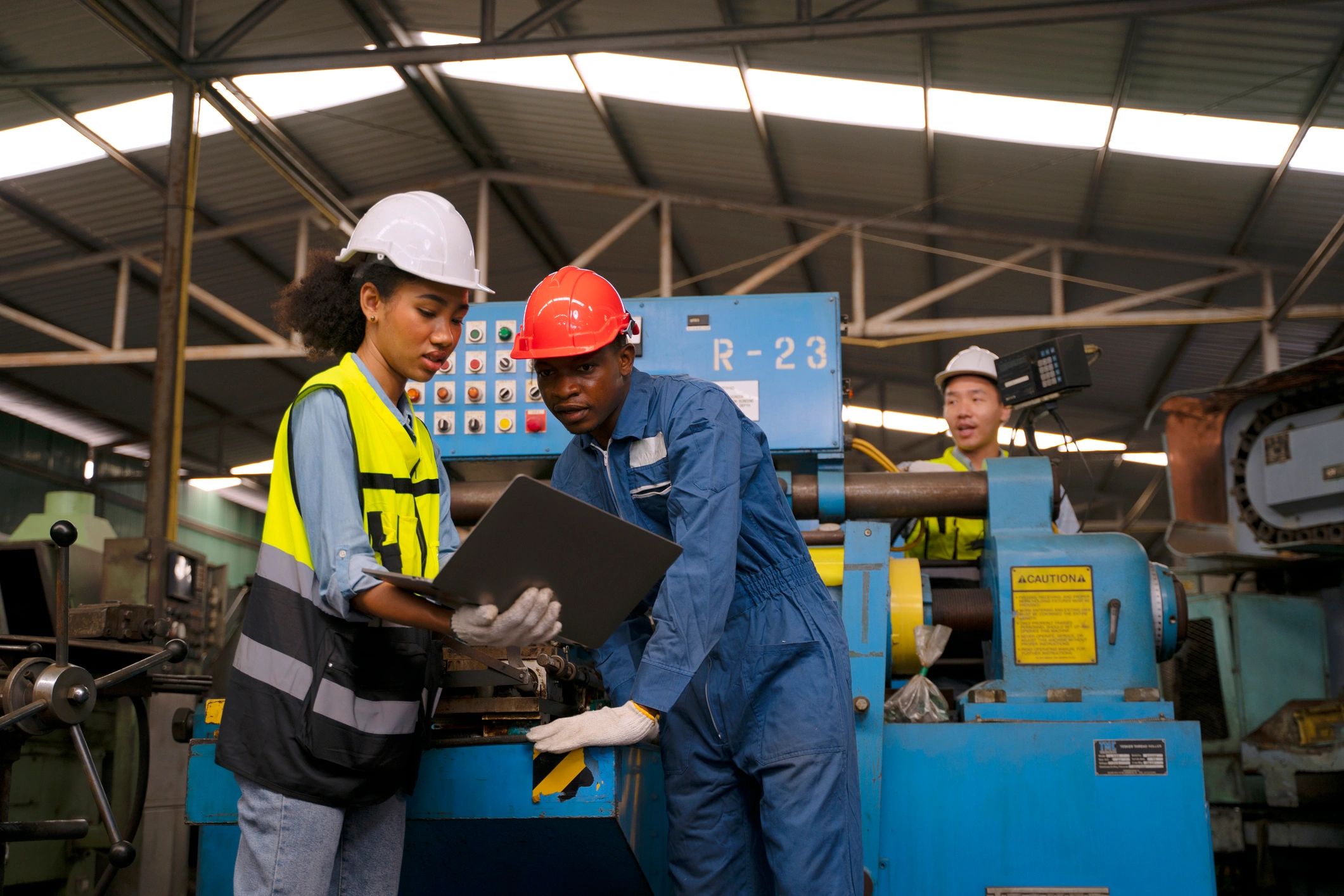 Engineering team collaborating in an industrial facility