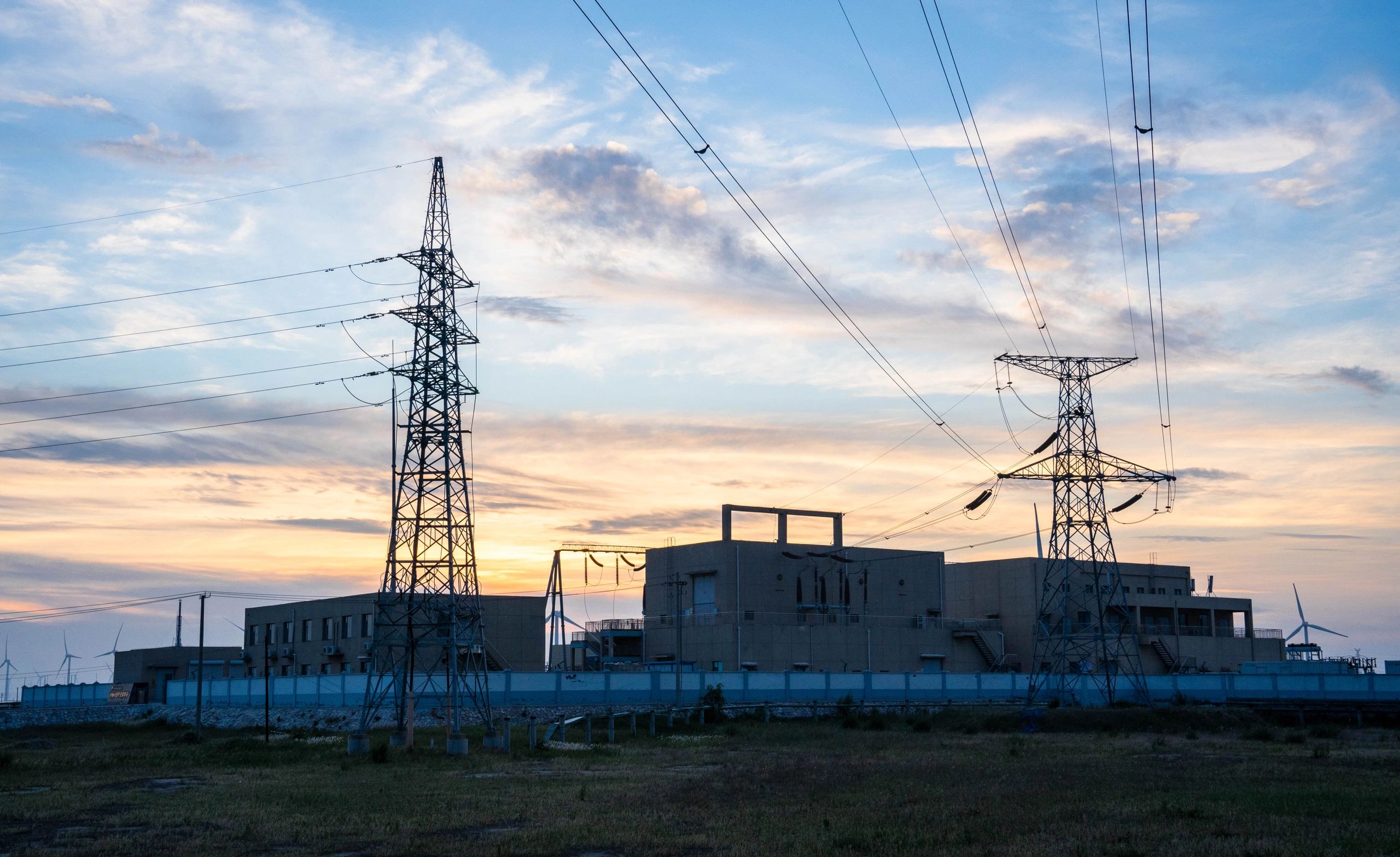 Power transmission and generation assets at dusk